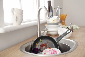 Many dirty dishes in kitchen