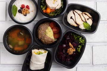 first course meal concept, chopped chicken breast and sliced sweet potato in food containersl. soup, Ready dish to eat