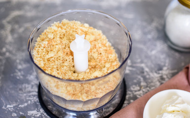 The process of creating dessert with the hands of a pastry chef. Cream, cake, sugar.