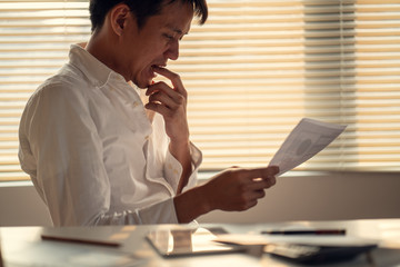 Fototapeta premium Business man stress and worry about late time to finish working project