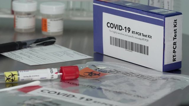 Covid- 19 Coronavirus test kit in medical lab with vile and swab.