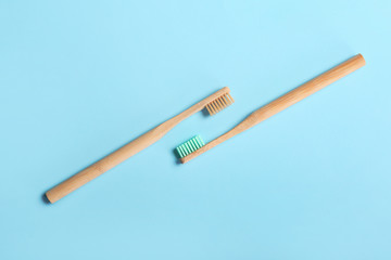 Wooden tooth brushes on color background