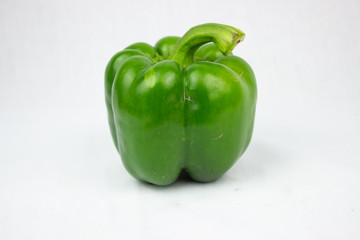 green bell paprika on white background