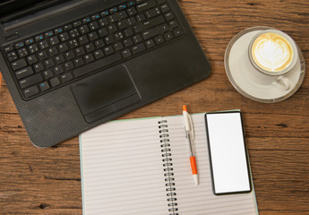 Office desk table with laptop, supplies and tablet . Top view with copy space