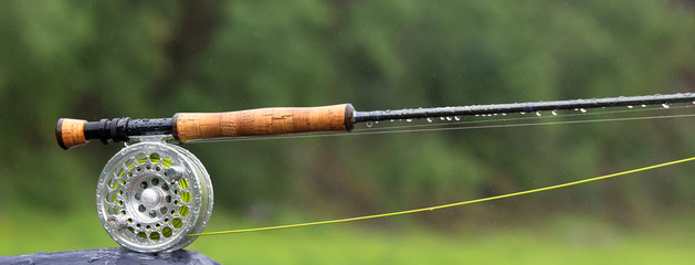 Fragment of a fly fishing rod with dew drops - 336320503