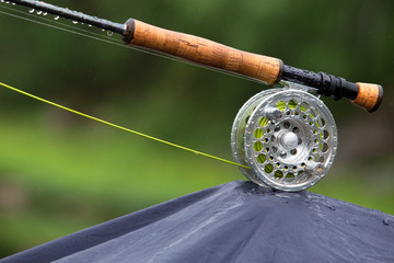 Fragment of a fly fishing rod with dew drops