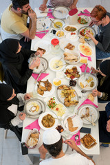 Muslim family gathering for having Iftar in Ramadan together