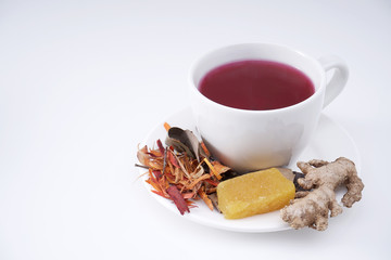 Wedang uwuh is an traditional herbal drink from Java Indonesia, the corona virus antidote. isolated on white with space