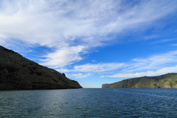 Fototapeta na wymiar The entrance to Akaroa Harbour, Banks Peninsula, New Zealand. To the left is Akaroa Head and Timutimu Head is on the right