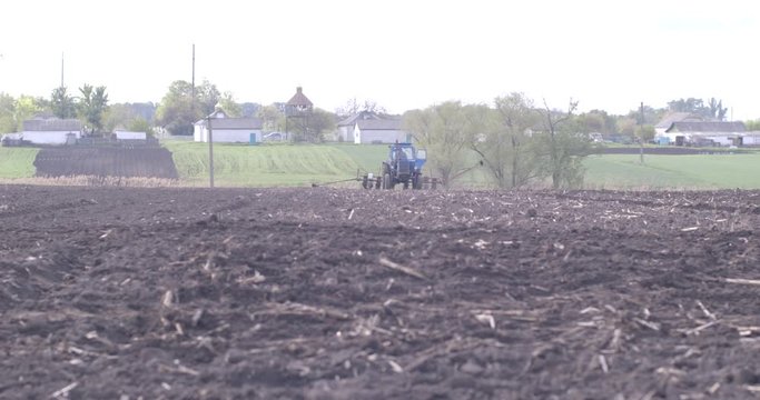 Natural eko fertilizer with manure. Farmer fertilizing arable land. Manure intended for land fertilizer before planting the crop.