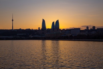 Fototapeta na wymiar Sunset of Baku, Azerbaijan . Fire towers in the night