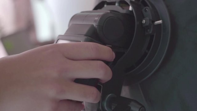 Closeup View Of Pulling External Flash Of A Camera And Putting It Back - Slowmo