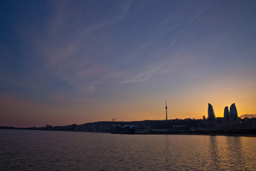 Fototapeta premium Sunset of Baku, Azerbaijan . Fire towers in the night