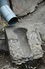 Rain drain near the old house.