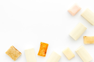 Soap bars flat lay on white background top-down copy space frame
