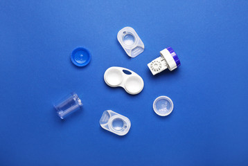 Containers for contact lenses on color background