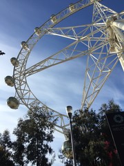 Ferris wheel on a blue sky