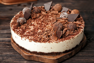 Tasty chocolate cheesecake on table