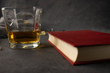 glass of cognac and books