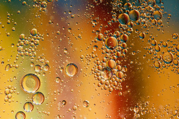 oil with bubbles on on dark blue background. Abstract background.