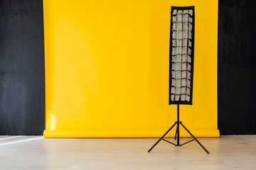flash and accessories photo studio on a yellow background