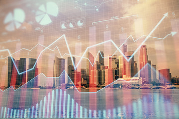 Forex chart on cityscape with tall buildings background multi exposure. Financial research concept.