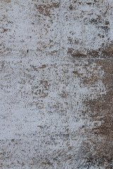 the texture of the concrete wall is poorly painted