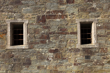 Fototapeta na wymiar Bodmin (England), UK - August 20, 2015: Bodmin Jail Naval Prison outside view of windows, Cornwall, England, United Kingdom.