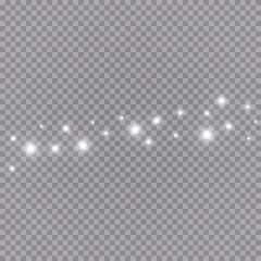 The dust sparks and white stars shine with special light. Vector sparkles on a transparent background. Christmas light effect. Sparkling magical dust particles.