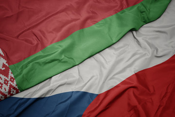 waving colorful flag of czech republic and national flag of belarus.