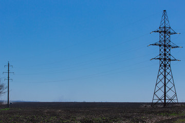 Spring fields electric towers sky without clouds
