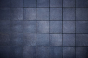 Abstract background from dark gray tiles