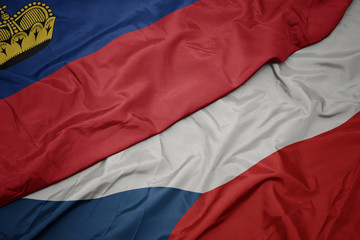 waving colorful flag of czech republic and national flag of liechtenstein.
