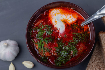 Ukraine borscht with sour cream, garlic and bread