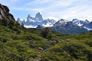 Fototapeta premium Hiking Trail to the Laguna de Los Tres in National Park in El Chalten, Argentina, Patagonia with snow covered Fitz Roy Mountain in background