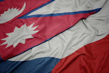 waving colorful flag of czech republic and national flag of nepal.