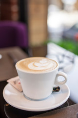 A cup of coffee designed by cream