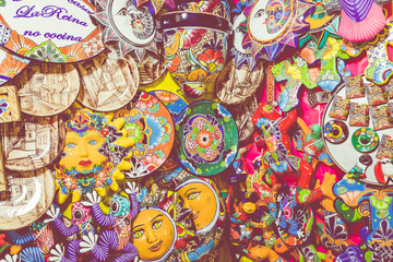 Fototapeta na wymiar Colorful traditional Mexican pottery. Talavera style. Souvenirs on sale in local market of Guanajuato, Mexico.
