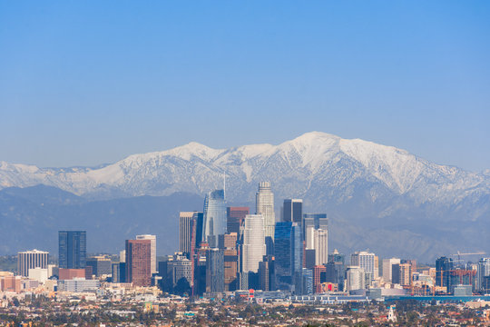 Downtown Los Angeles Skyline from Afar with Snowy San Gabriel Mountains