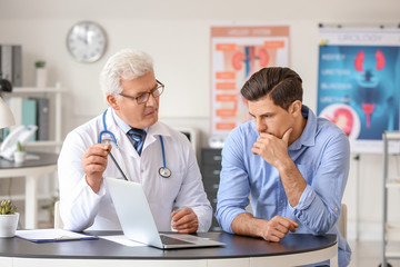 Young man visiting urologist in clinic