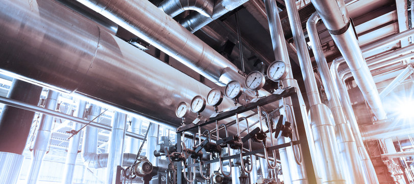 Equipment, cables and piping in red tones