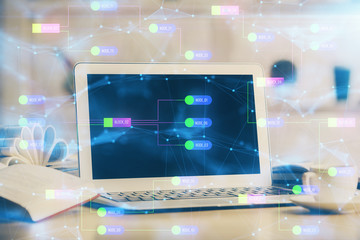 Double exposure of desktop computer and technology theme hologram. Concept of software development.