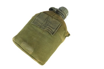 A military flask with a white lid is remembrance of what is left from military training.