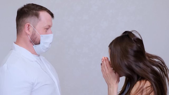 A sick woman has flu or cold symptoms and sneezes in the presence of a doctor. The doctor is outraged and tries to hit the patient. Comic situation, joke
