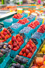 Variety of fresh fruit for sale on a farmers market stall