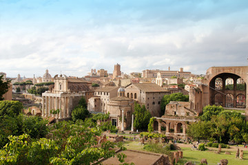 Aerial panoramic cityscape view of the Roman Forum during sunset in Rome, Italy