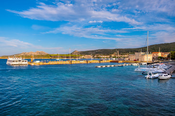 Fototapeta na wymiar Palau, Italy - Panoramic view of touristic yacht port and marina - Porto Turistico Palau - with yachts pier and at the Costa Smeralda coast of Tyrrhenian Sea