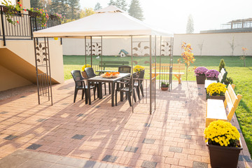 Patio with garden furniture and parasol