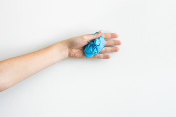 Fototapeta premium Blue medical gloves on the white background. Coronavirus rules .