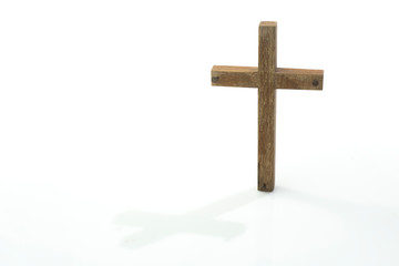 Wooden cross with nails on left and right ends isolated on white background